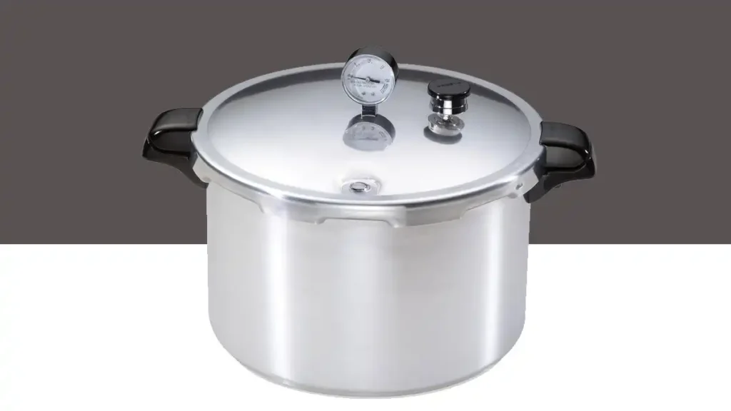 A large Presto aluminum pressure canner with a built-in dial gauge for home canning and bulk cooking.