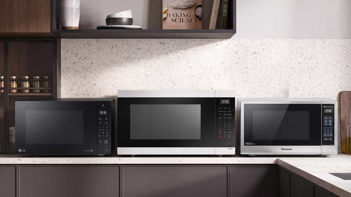 Samsung, Panasonic and LG countertop microwaves side by side in a kitchen